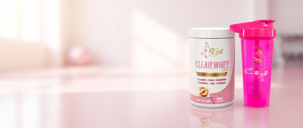 FitGirl Clear Whey next to the neon pink shaker